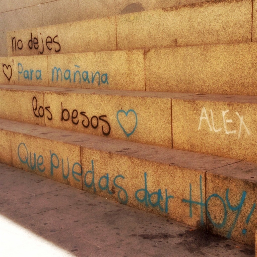 Outside the train station. Translation: "Don't leave for tomorrow the kisses you can give today." Córdoba