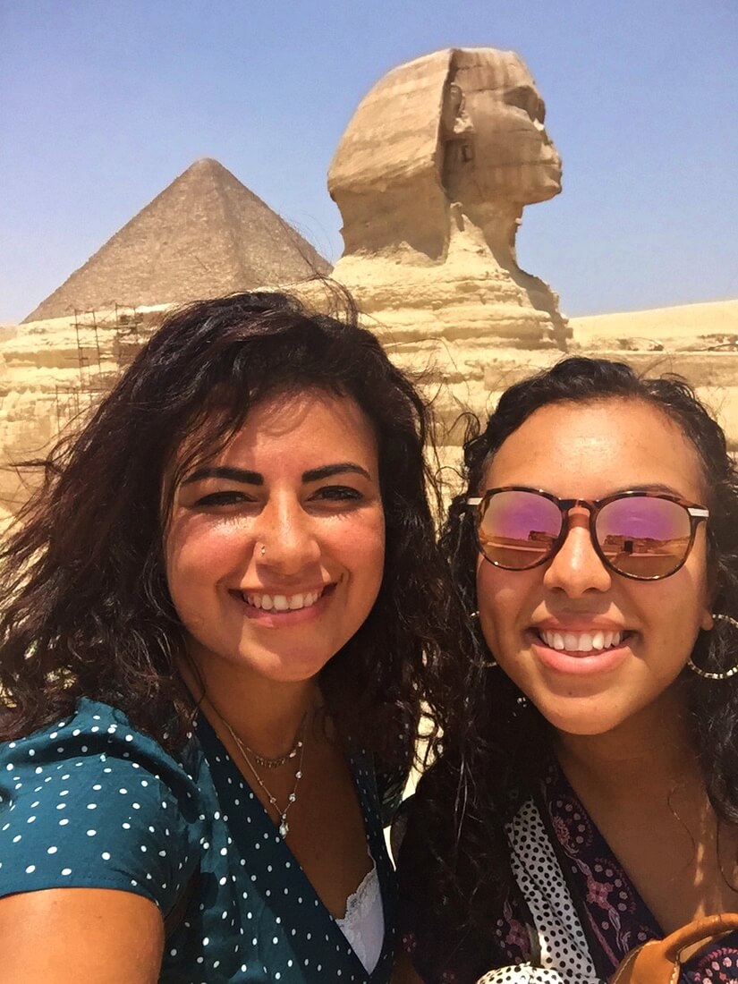My friend and I in front of the Sphinx - The Ultimate Guide to Visiting the Pyramids of Giza in Egypt