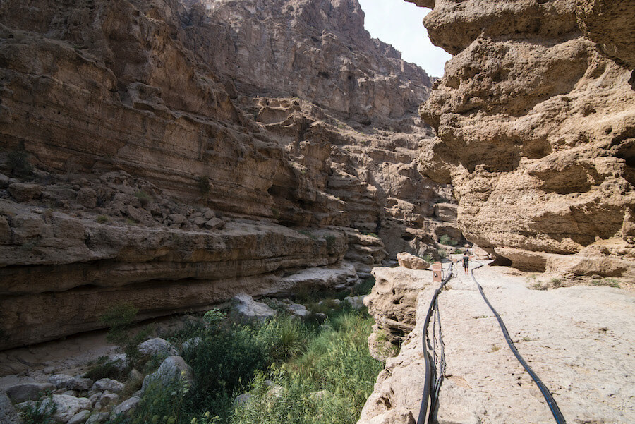 Planning a trip to Oman? You HAVE to visit Wadi Shab! Click to read how to get to Wadi Shab, what to expect when you arrive, plus why you should plan a trip there (and to Oman). | Oman Travel | Muscat to Wadi Shab | Sur to Wadi Shab | Oman Road trip | Wadi Shab Guide